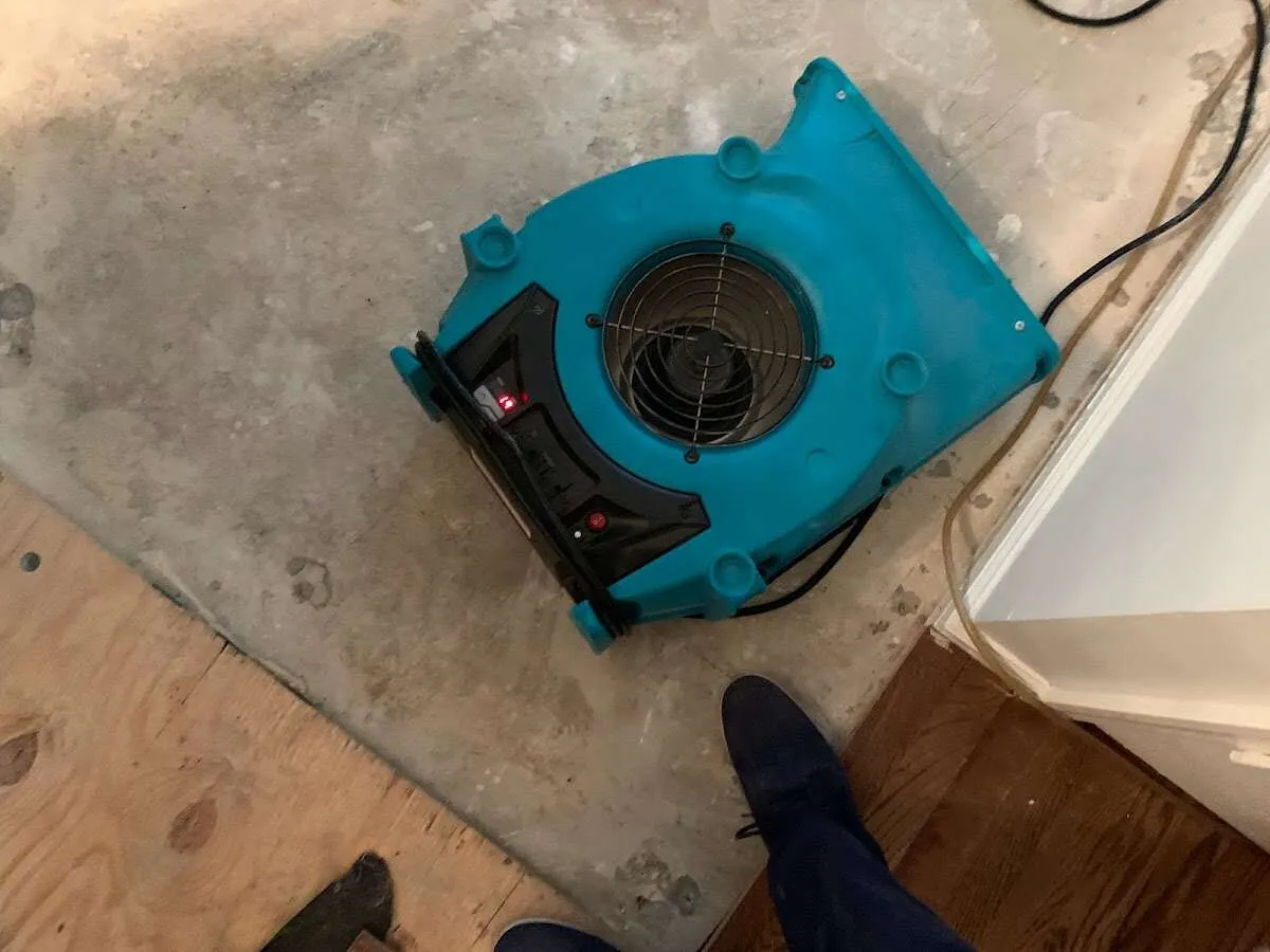 Air mover drying subfloor during Commercial Water Damage Restoration in Sunland Park